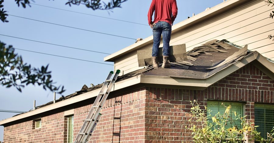 Roofer working on a residential tear-off