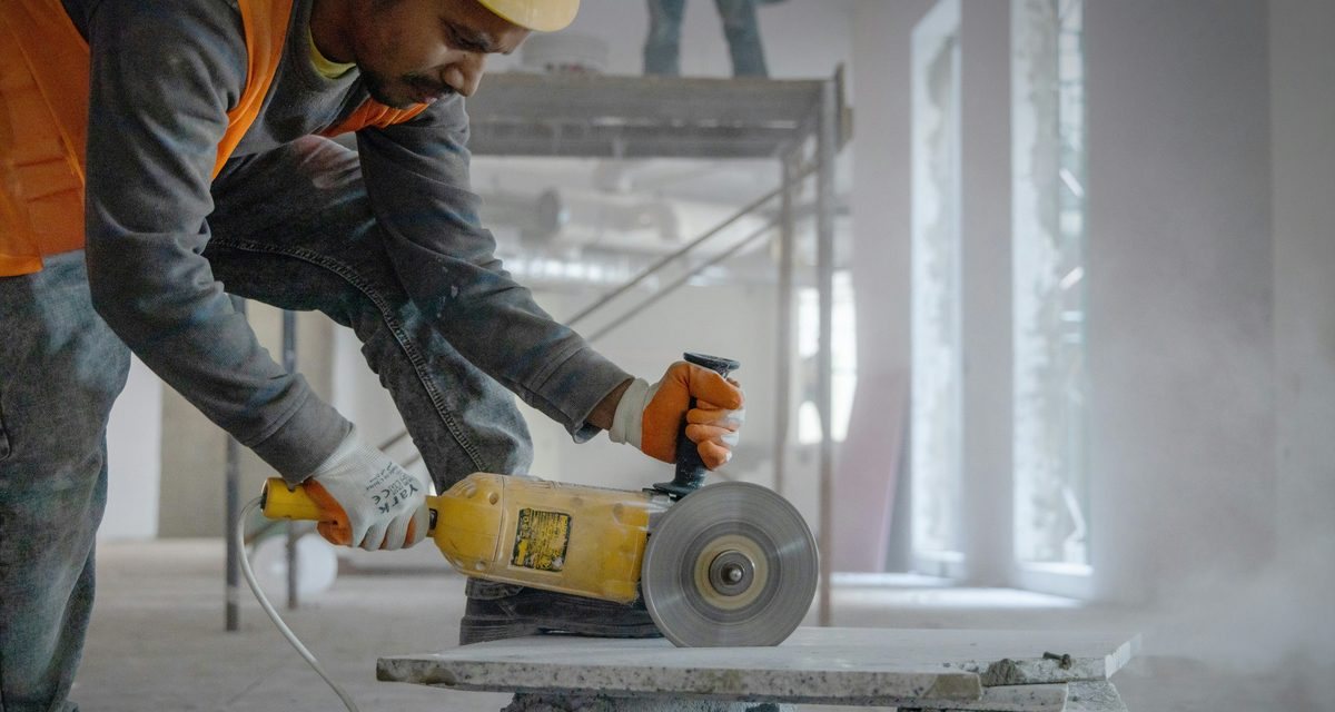 Tradesman cutting masonry on site